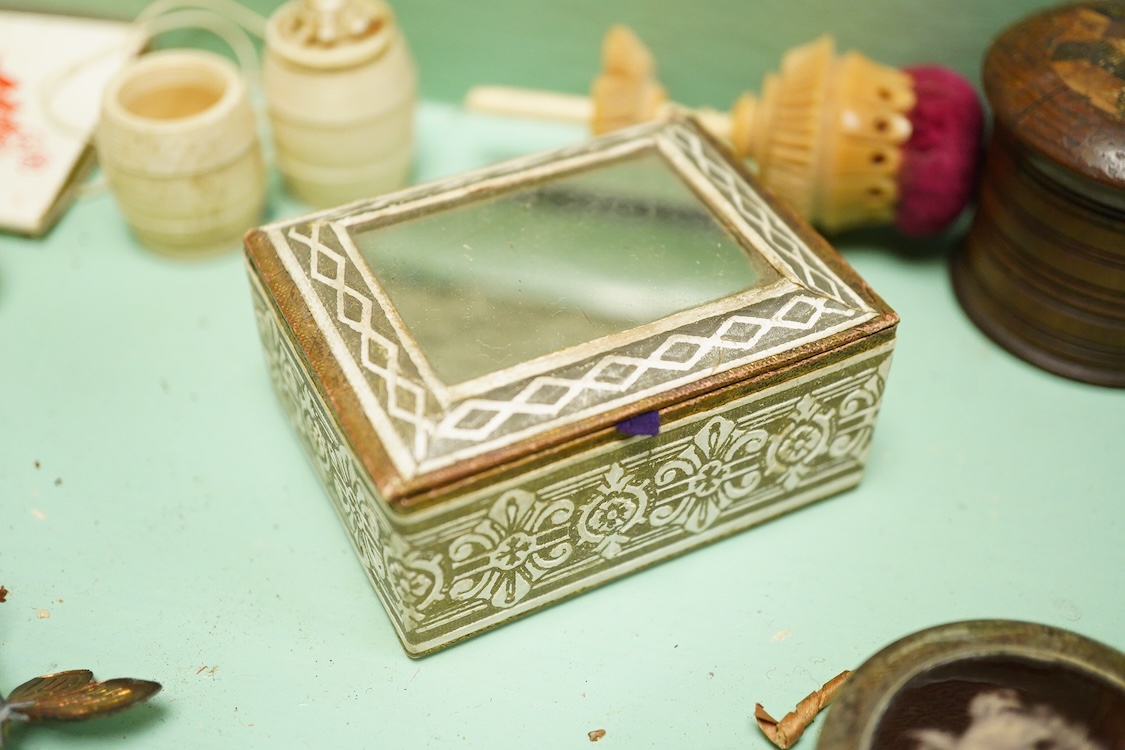 A Victorian mother of pearl inlaid rosewood sewing box and contents including a silver thimble and carved bone thread reels, 33cm wide